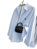 Classic Striped Button-Down Shirt with Subtle Chest Graphic and Relaxed Fit