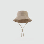 Minimalist Bucket Hat with Soft Brim and Decorative Tassel Detail for Everyday Outdoor Style