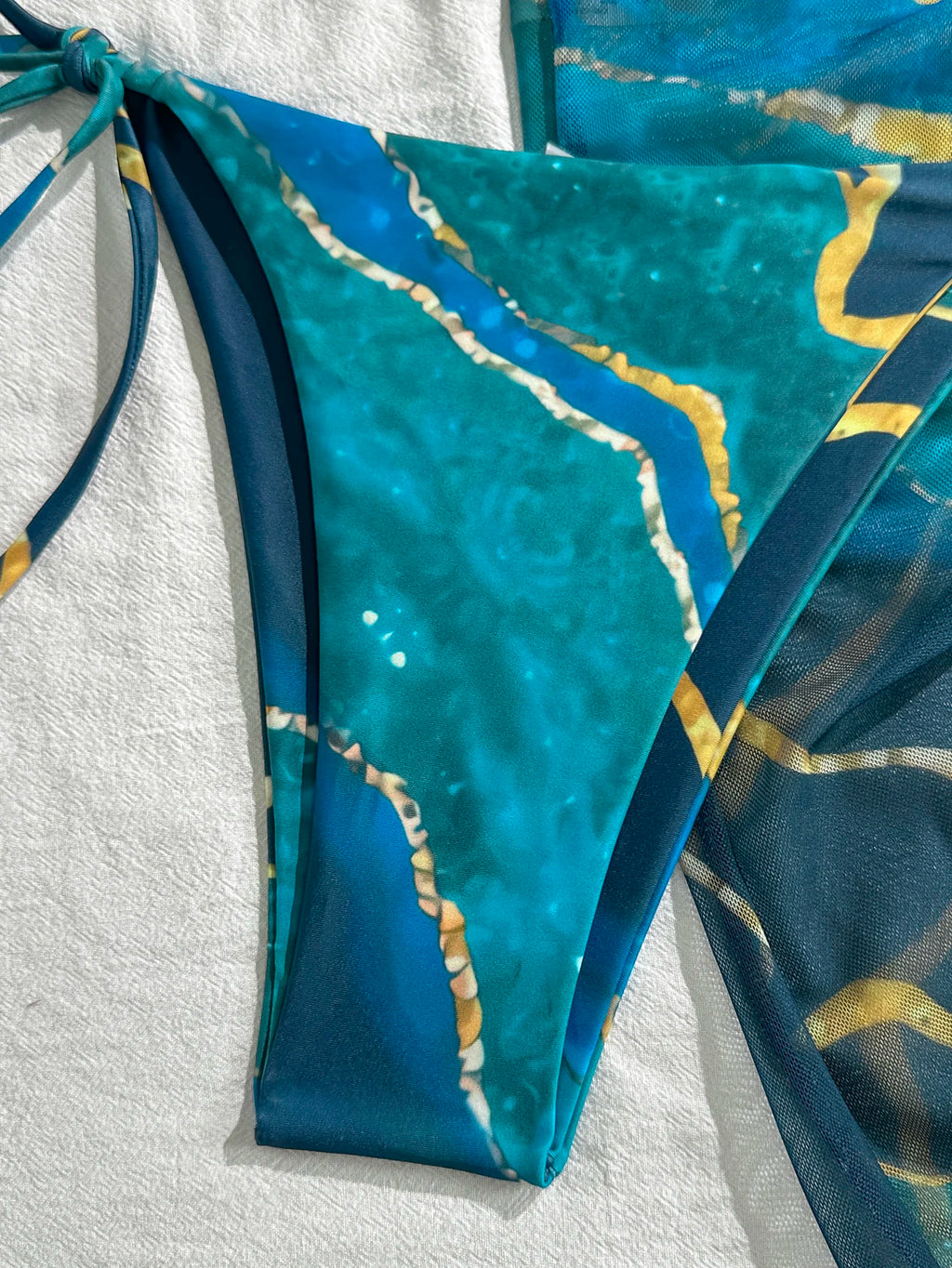 Vibrant Blue Marble Print String Bikini Set with Sheer Mesh Wrap Skirt