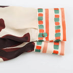Bold Abstract Floral Print Button-Down Blouse with Contrast Trim