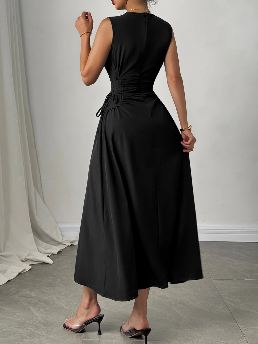 Minimalist Black Sleeveless A-Line Dress with Corset-Style Side Lacing Detail
