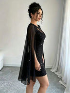 Glamorous Black Glitter Mini Dress with Sheer Lace Yoke and Flowing Cape Sleeves