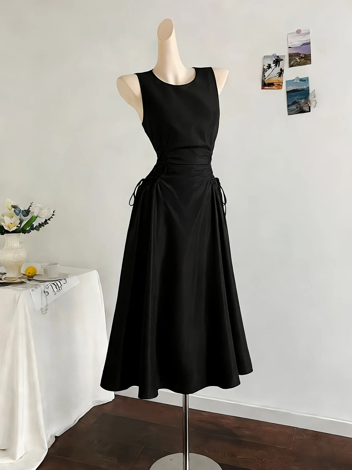Minimalist Black Sleeveless A-Line Dress with Corset-Style Side Lacing Detail