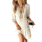 Embroidered V Neck Tiered Mini Dress with Relaxed Contemporary Shape