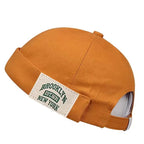 Minimalist Folded Cuffed Beanie with Woven Patch Detail for Contemporary Streetwear Fashion