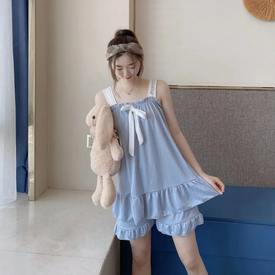 Soft Pink Two-Piece Women's Pajama Set with Bow-Tie Front, Sleeveless Cami Top and Coordinating Ruffle-Hem Shorts