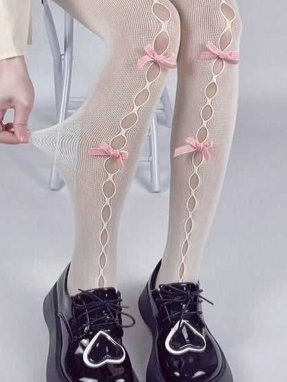 Decorative Bow Fishnet Thigh High Stockings with Open Mesh Pattern for Alternative Fashion Styling