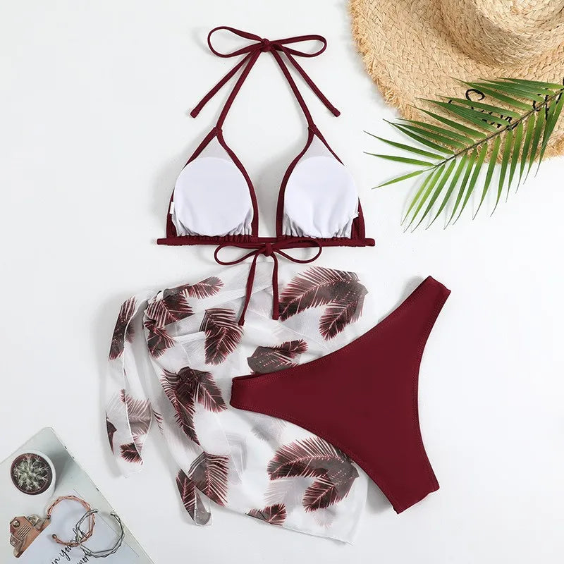 Emerald Green Three-Piece Bikini Set with Halter Triangle Top, Matching Bikini Bottom and Printed Beach Wrap