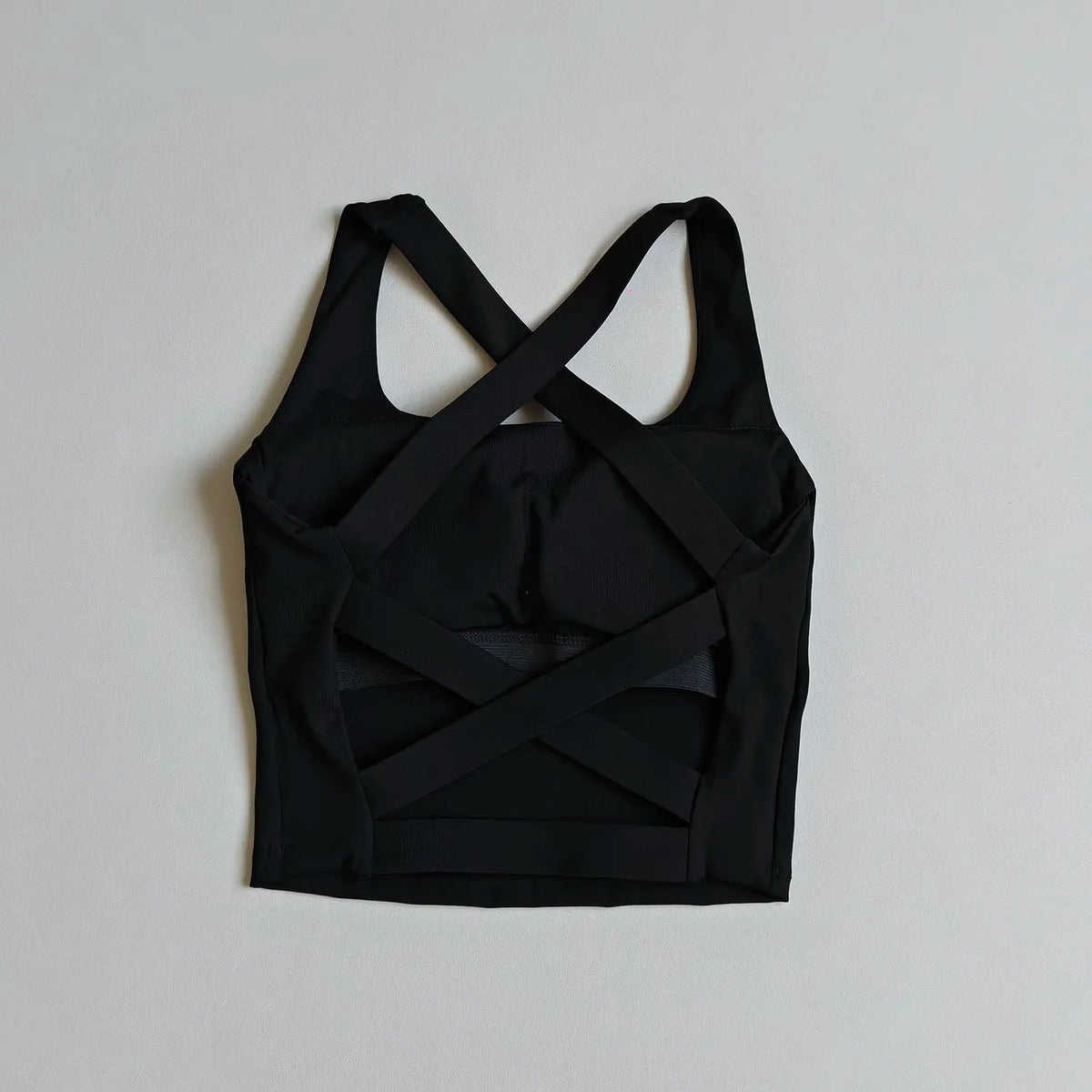 High-Coverage Sports Bra with Architectural Criss-Cross Strappy Back