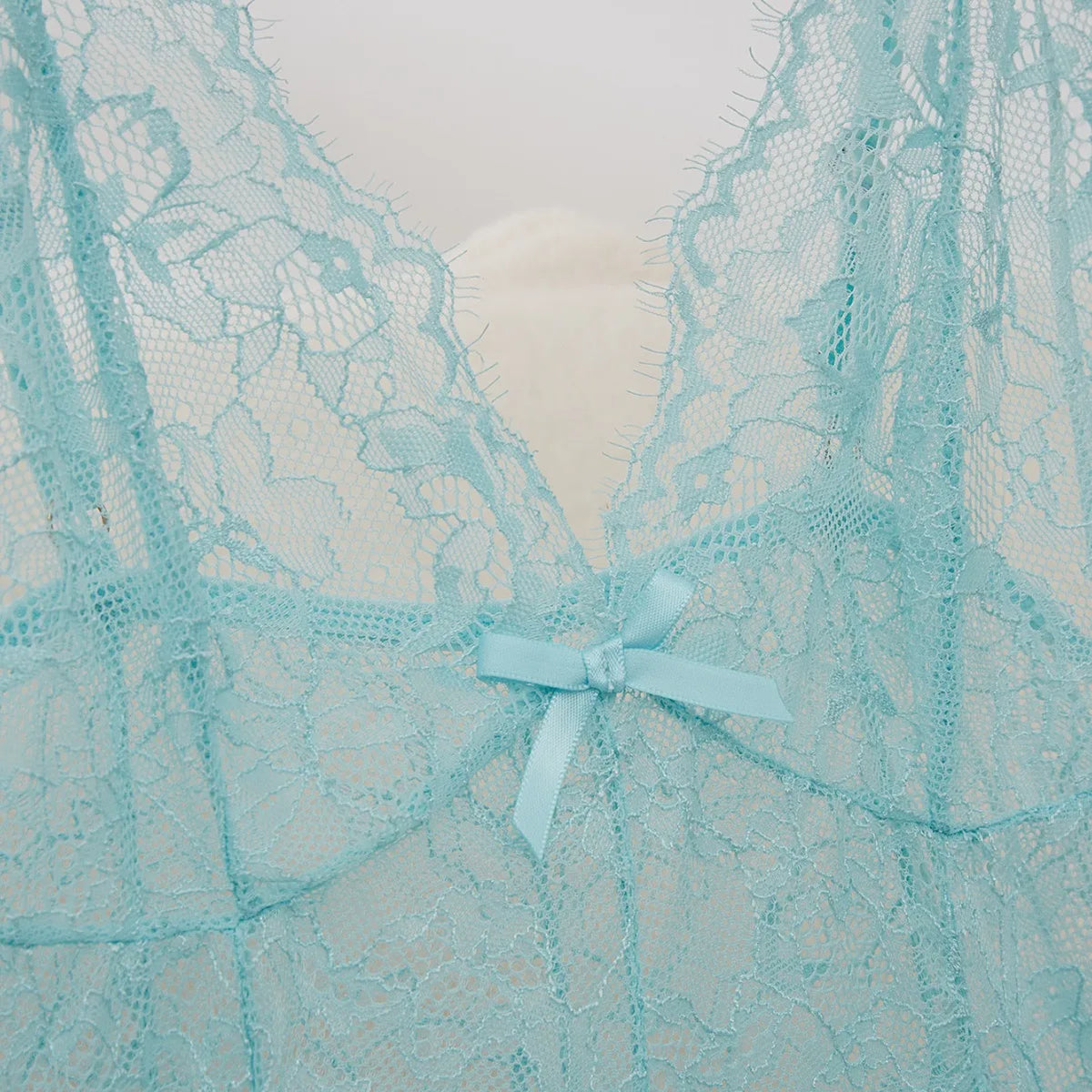 Soft Pink Sheer Lace Chemise with Plunging V-Neckline and Flowing Skirt