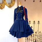 Medieval-Inspired Green and Black Flared Coat Dress with Decorative Bow and Brass-Tone Buttons